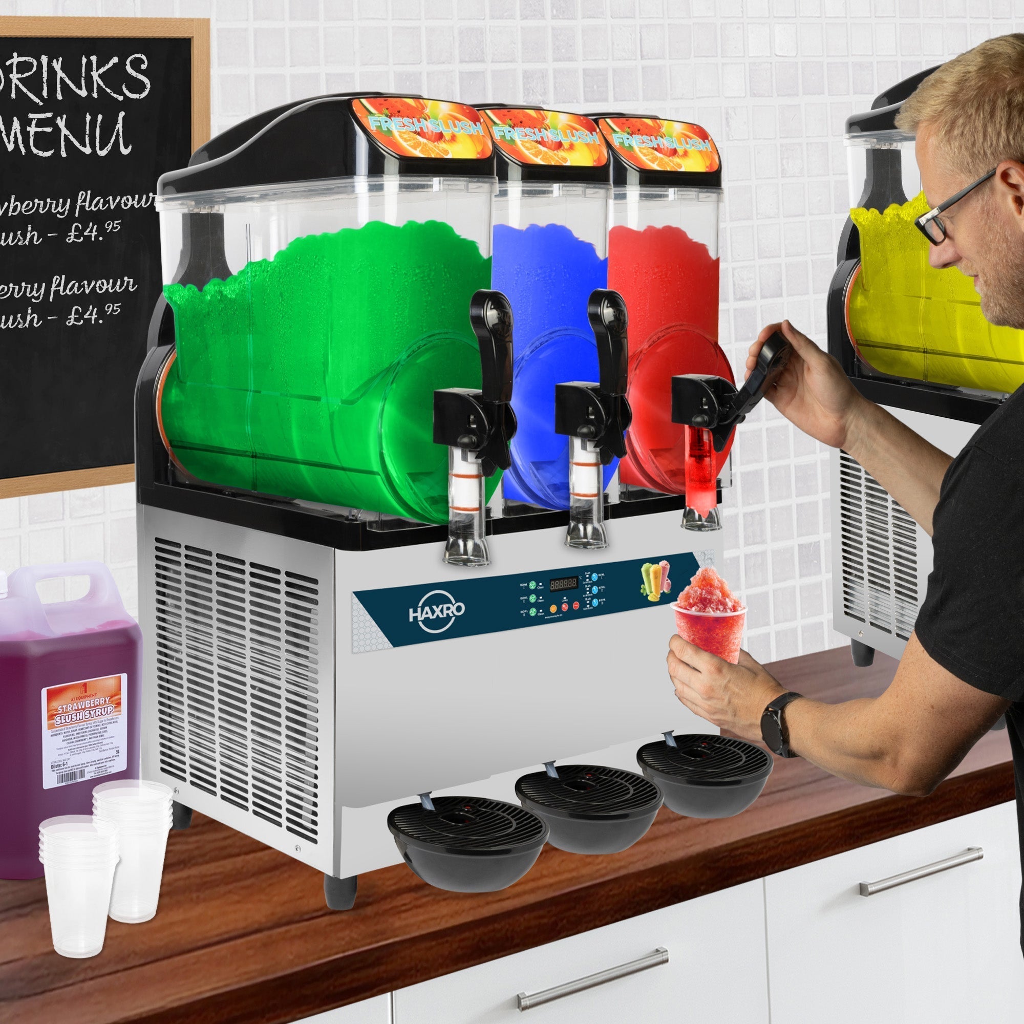 Haxro Slush machine set up on a counter top with someone using it. There slush machine has 3 bowls, with a green, blue and red flavour.