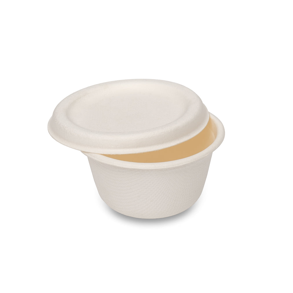 A small, round, white container with a lid, made of biodegradable material.