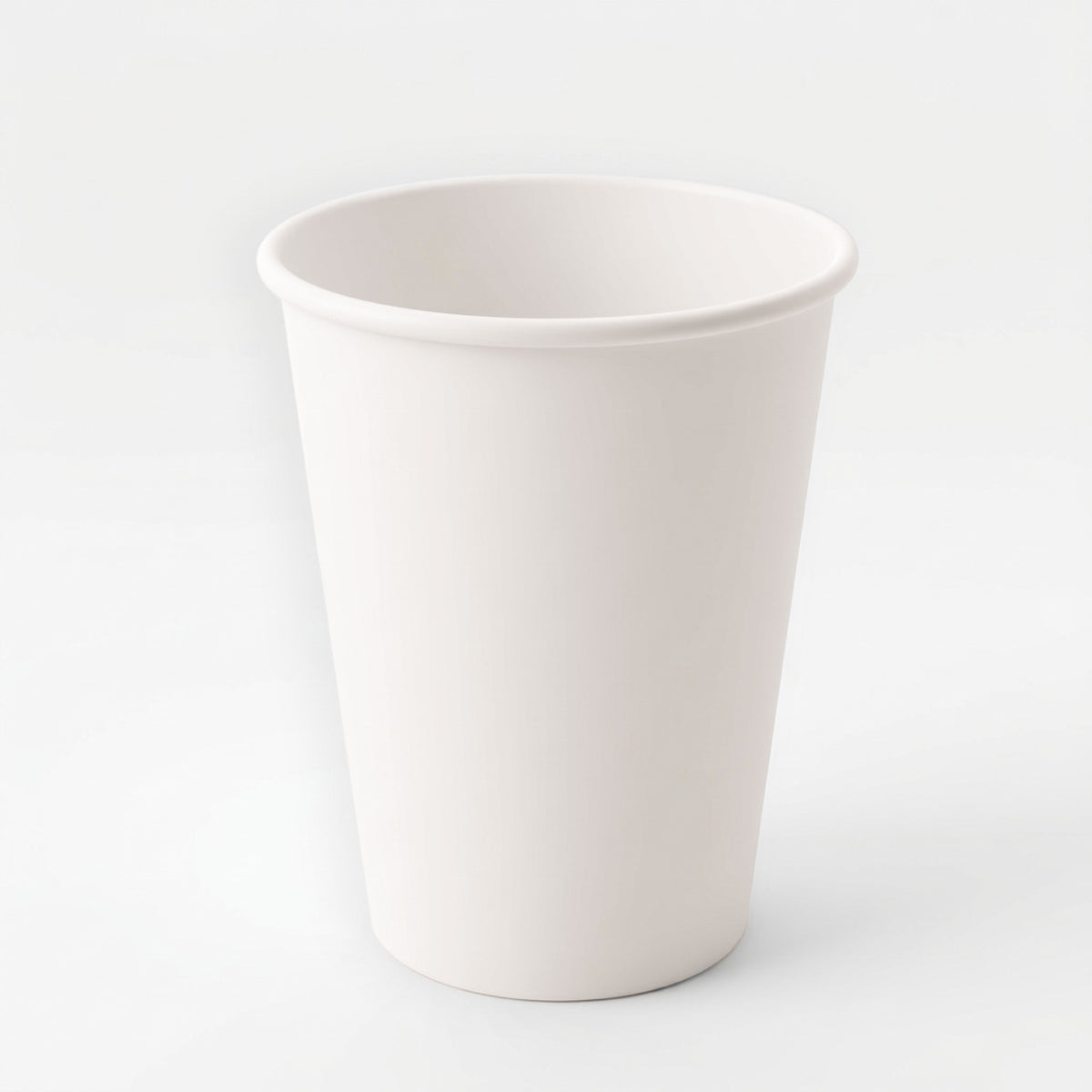 A plain, white paper cup is centered against a light gray background. The cup is empty, standing upright, and conveys a neutral, minimalist tone