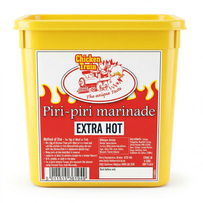 2kg yellow plastic tub of Chicken Train Piri-Piri Marinade (Extra Hot) with a red flame design label, Chicken Train logo featuring a chicken on a train, bold “EXTRA HOT” text, ingredients and usage instructions, barcode, and Best Before box on the front.