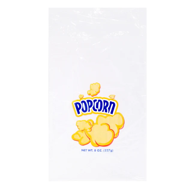Clear plastic popcorn bag featuring a graphic of yellow popcorn with "POPCORN" in bold blue letters. Below, it reads "Net Wt. 8 oz. (227g)."