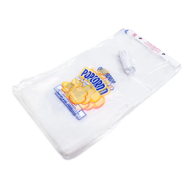 Clear plastic popcorn bags, stacked together with twist ties on top. The top bag features colorful, cartoon popcorn graphics and bold lettering.