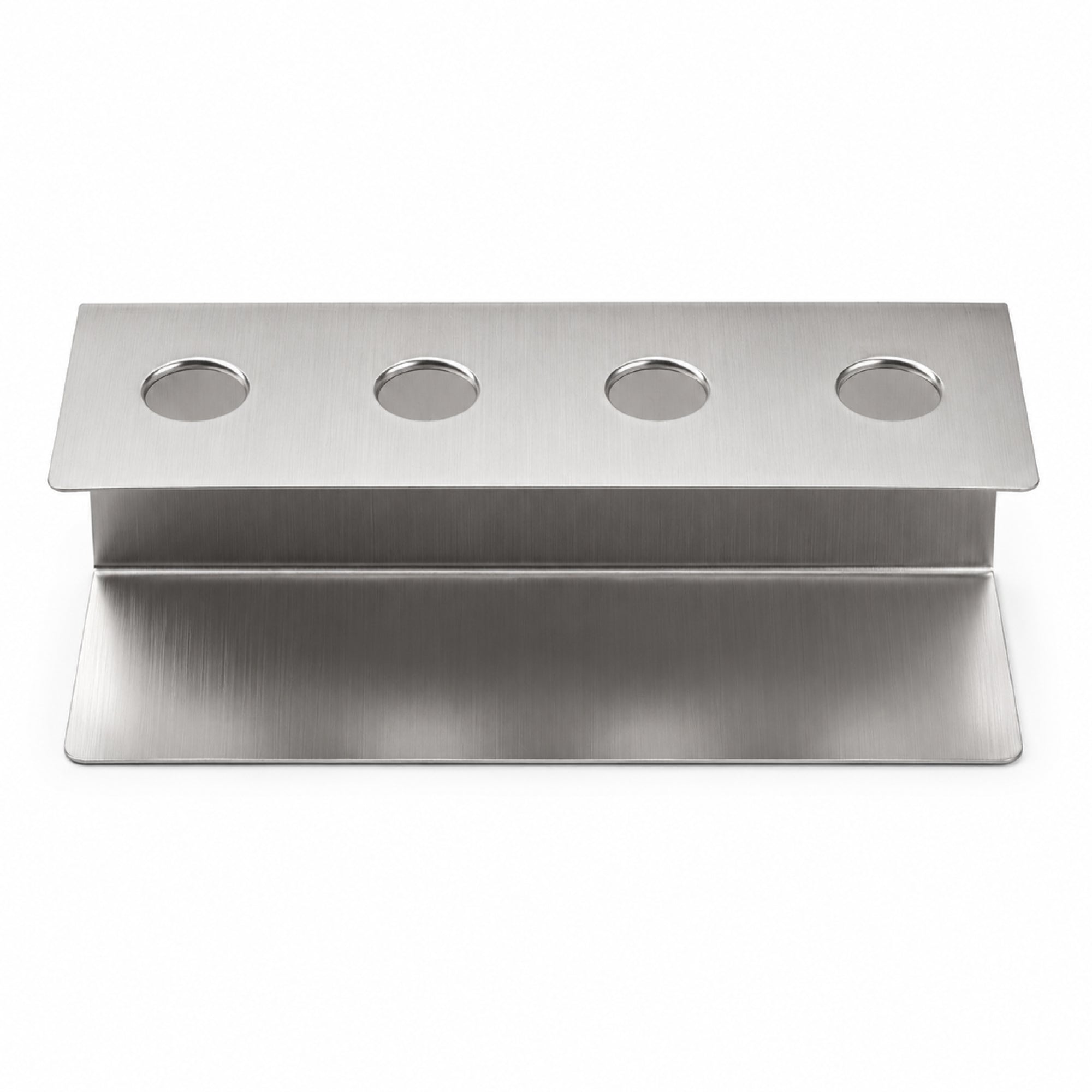 A stainless steel countertop condiment caddy with four circular sections.