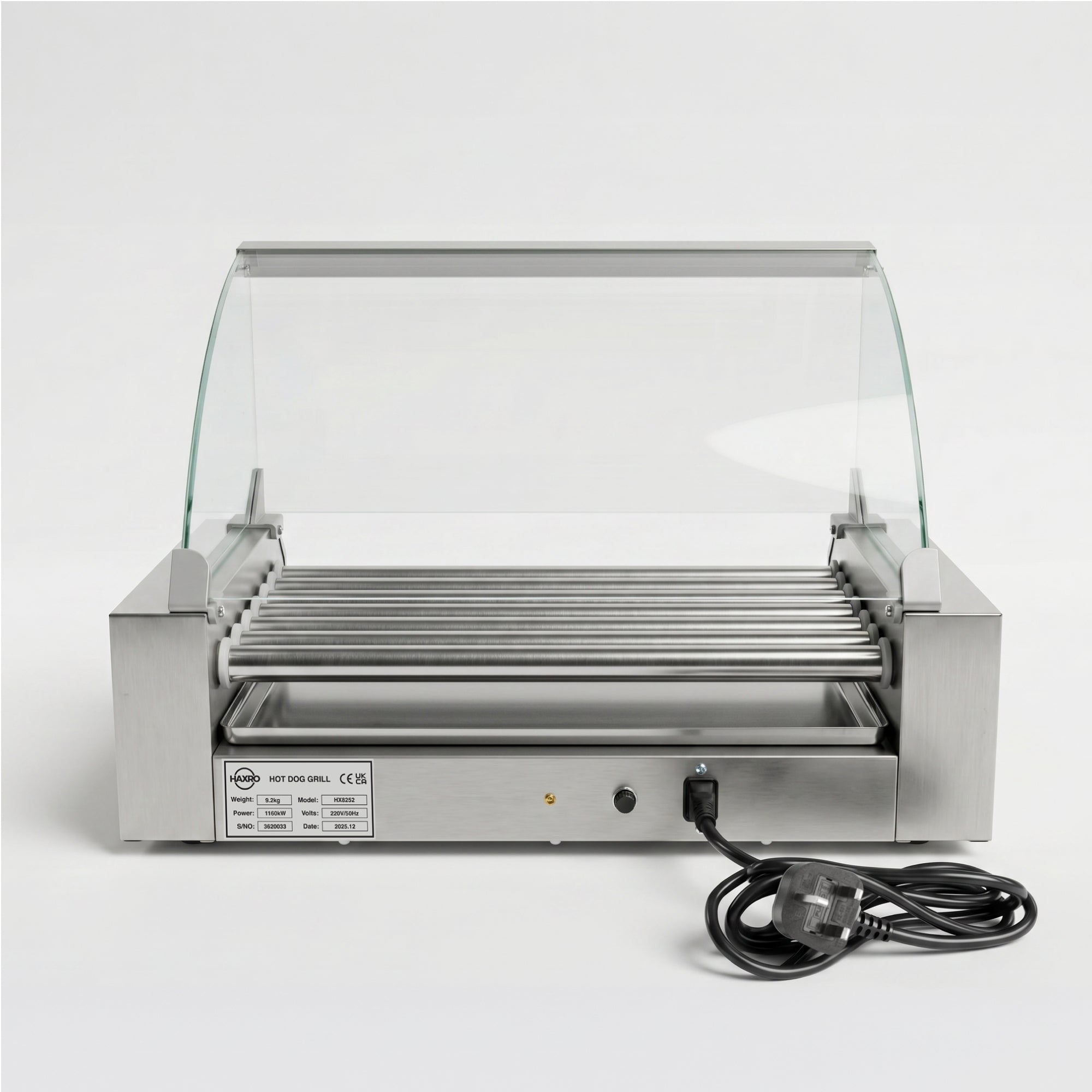 Hot dog roller grill with stainless steel rollers under a glass canopy, designed for commercial use. A power cord is attached, ready for operation.
