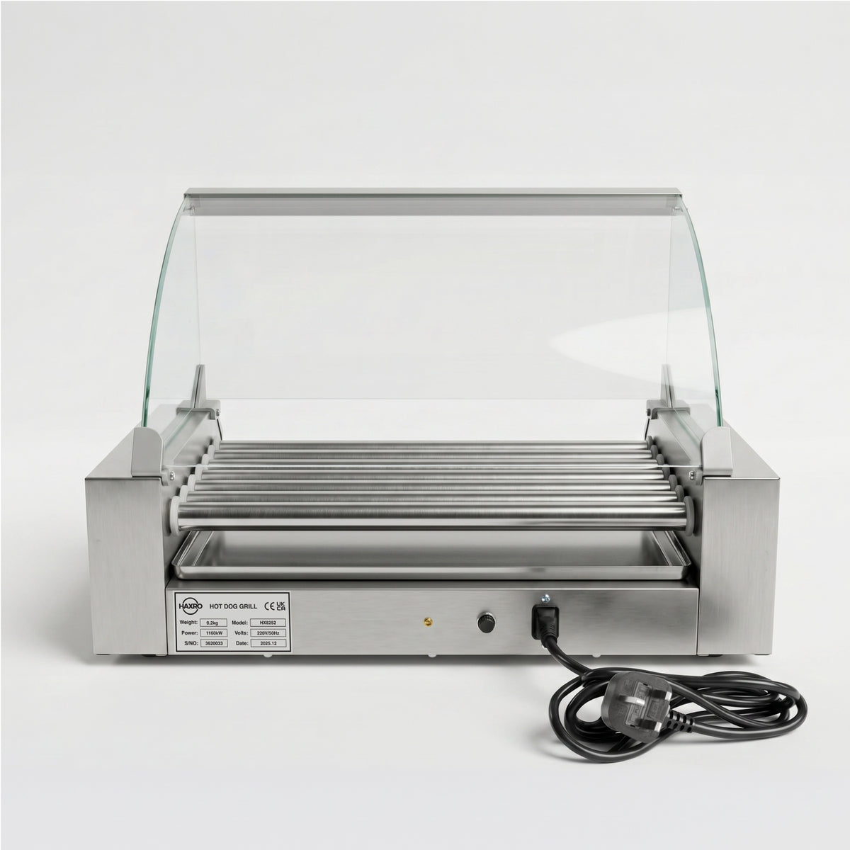 Hot dog roller grill with stainless steel rollers under a glass canopy, designed for commercial use. A power cord is attached, ready for operation.