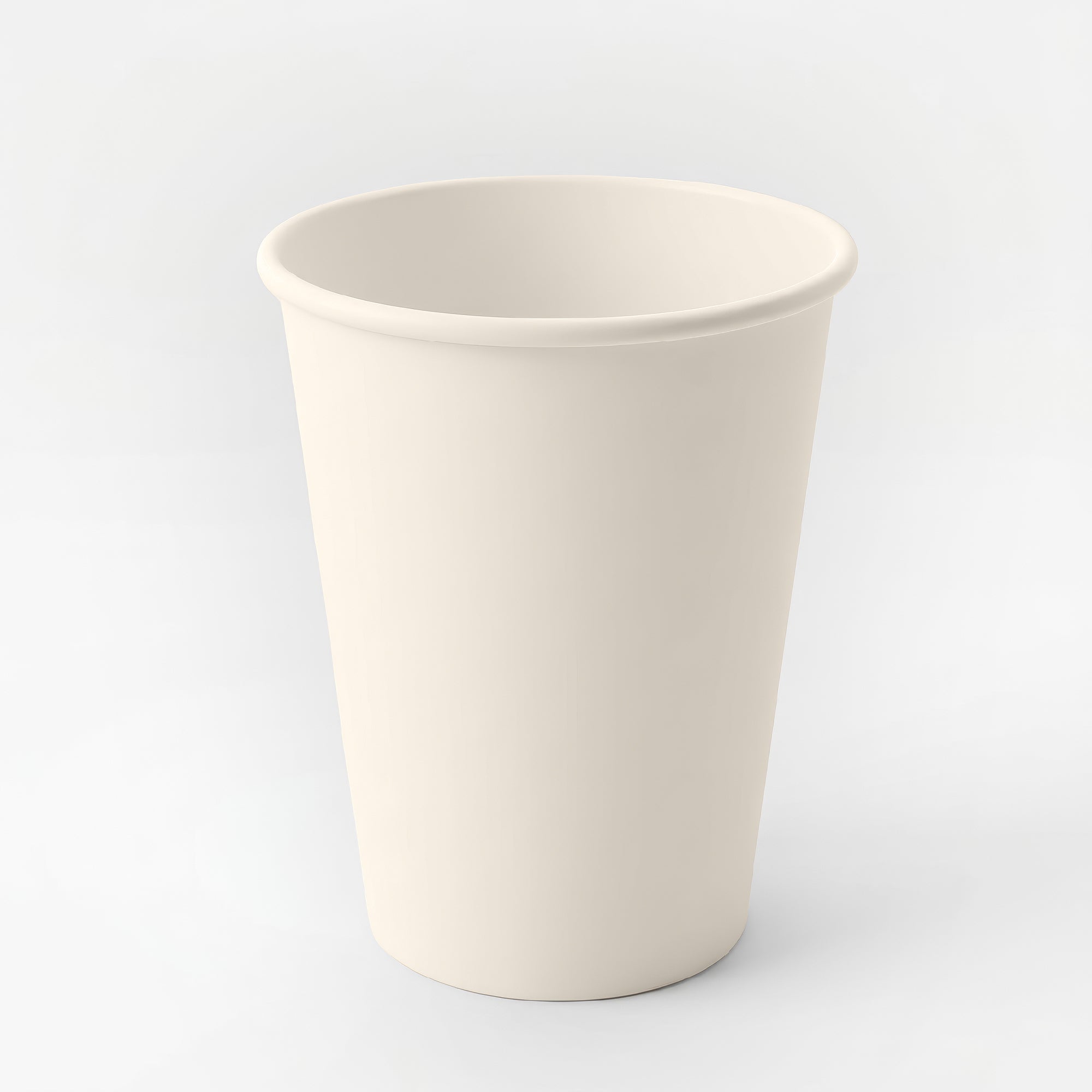 A plain, white paper cup is centered against a light gray background. The cup is empty, standing upright, and conveys a neutral, minimalist tone.