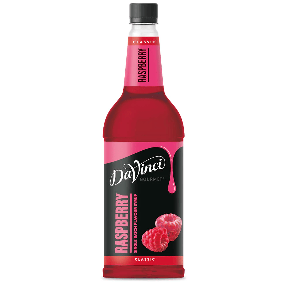A bottle of DaVinci Gourmet Raspberry syrup with a red liquid and raspberries on the label.