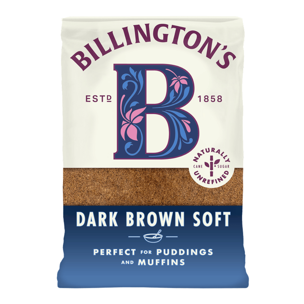 A bag of Billington’s Dark Brown Soft natural unrefined cane sugar, featuring a large decorative “B” logo, labeled “Est. 1858,” with text stating “Perfect for puddings and muffins” on a blue lower section and visible dark brown sugar through the packaging.