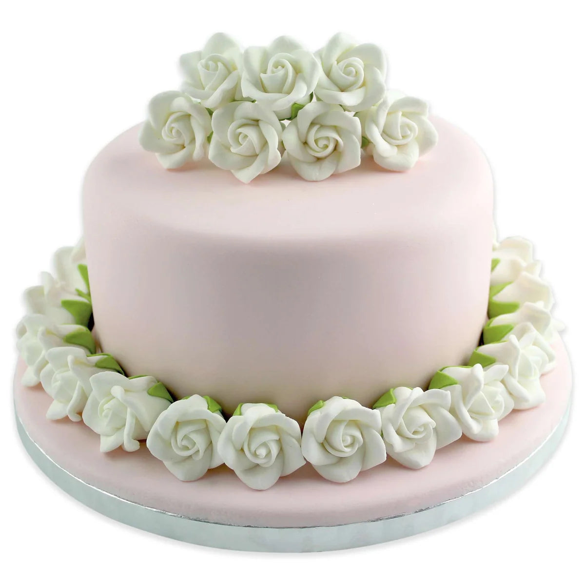 A round light pink cake decorated with white sugar roses around the top and base, set against a plain white background.