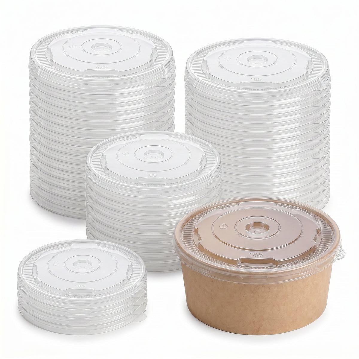 Stacks of round clear plastic lids are neatly arranged alongside a single brown paper bowl with a plastic lid. The image conveys organization and cleanliness.