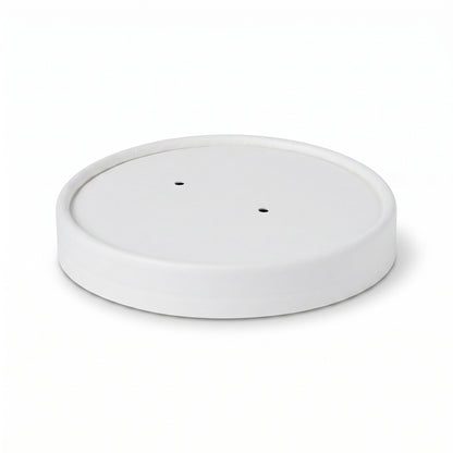 A round, white ceramic plant pot saucer with two drainage holes. The simple, minimalist design suggests a modern and clean aesthetic.