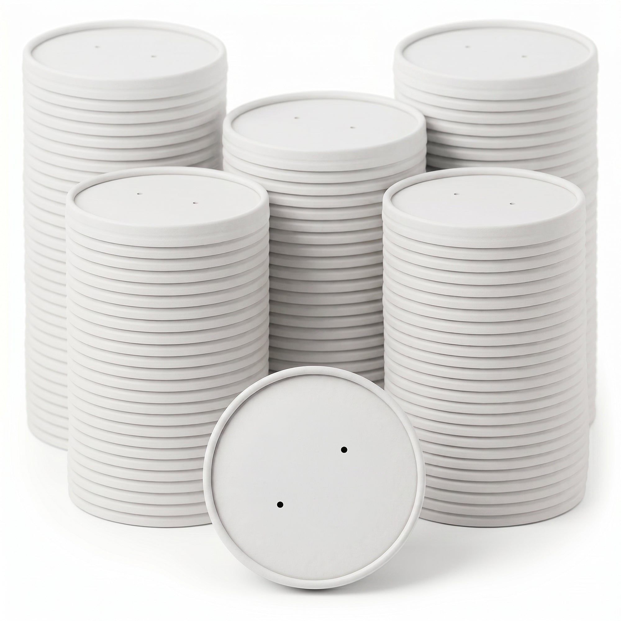 Stacks of white paper discs with two small holes each are neatly arranged against a white background, conveying cleanliness and organization.