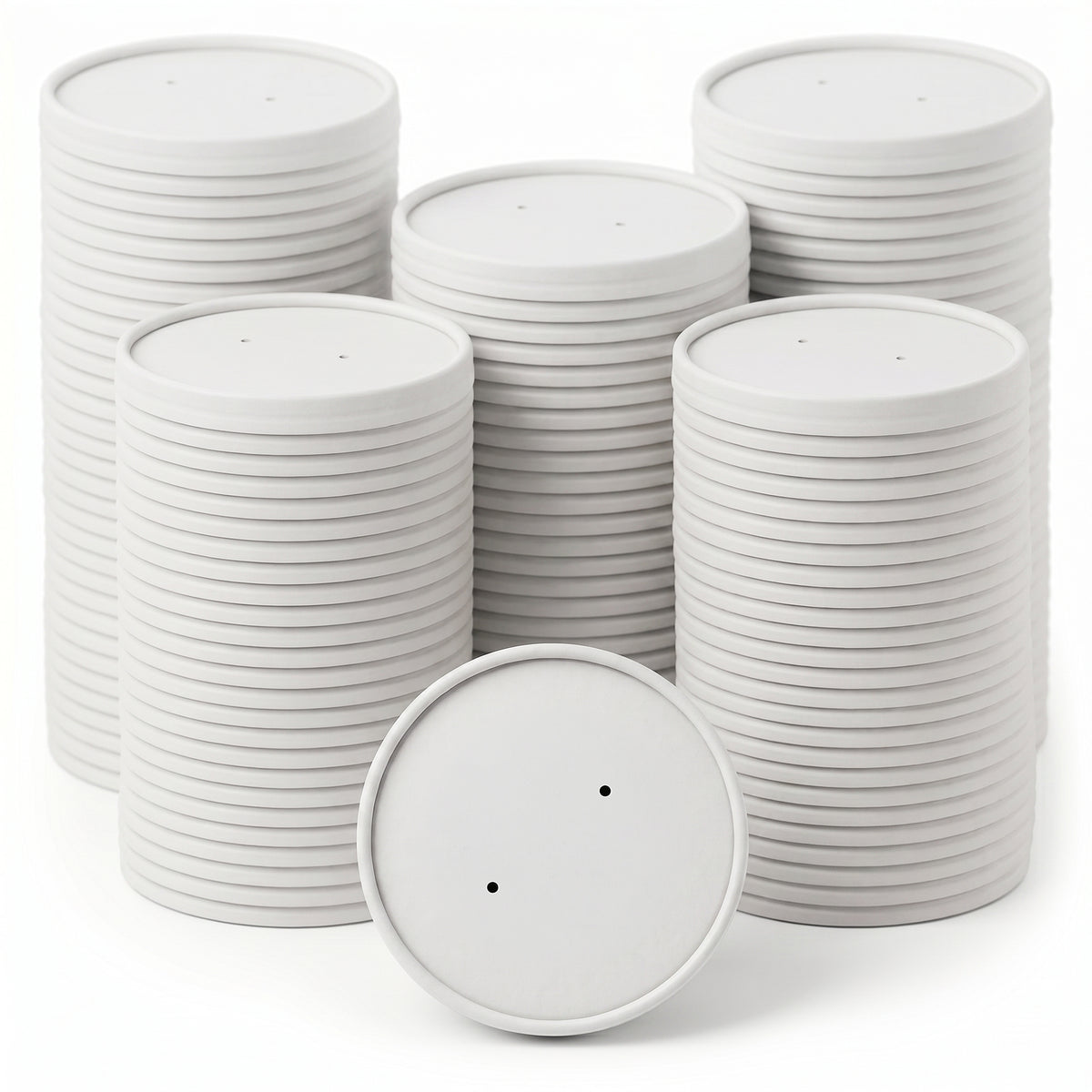 Stacks of white paper discs with two small holes each are neatly arranged against a white background, conveying cleanliness and organization.