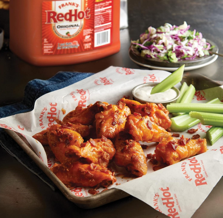A 3.78L gallon jug of Frank’s RedHot Original Cayenne Pepper Sauce with bold red and yellow branding. The label highlights its use of aged cayenne peppers and versatile application for wings, burgers, burritos, and more.