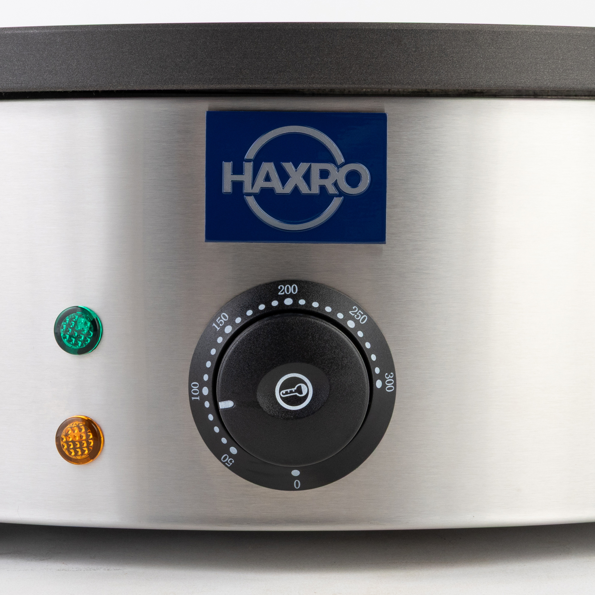 Haxro Crepe Maker dial with temperature settings, green power light, and orange indicator light.