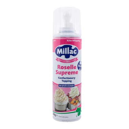 A can of Millac Roselle Supreme Confectionery Topping, a slightly sweetened UHT whipped cream alternative for professionals. The can is pink and white with images of whipped cream-topped desserts on the label and a white plastic nozzle cap on top.