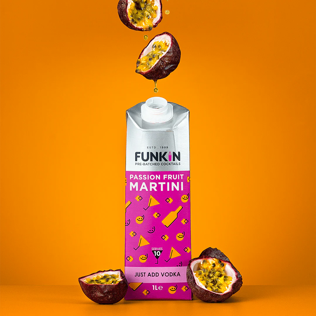 Bright, bold, and bursting with flavour

Experience a tropical twist with Funkin Passion Fruit Martini Mixer – a vibrant fusion of ripe Indian mango, tangy Ecuadorian passion fruit, and refreshing orange juice. Just add vodka or rum, shake well, strain over ice, and garnish with fresh passion fruit for a cocktail that tastes like paradise in a glass.