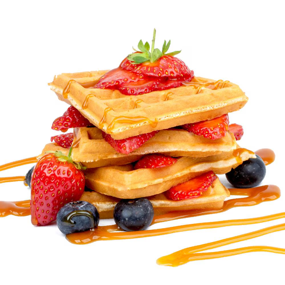A tower of waffles with layers of sliced strawberries, blueberries, and a caramel drizzle, set on a white background.