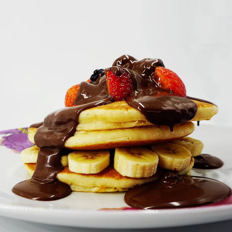 3.5kg tub of vegan liquid milk chocolate-flavoured sauce, a ready-to-use alternative to solid vegan chocolate, ideal for desserts—requires stirring before use to maintain consistency.