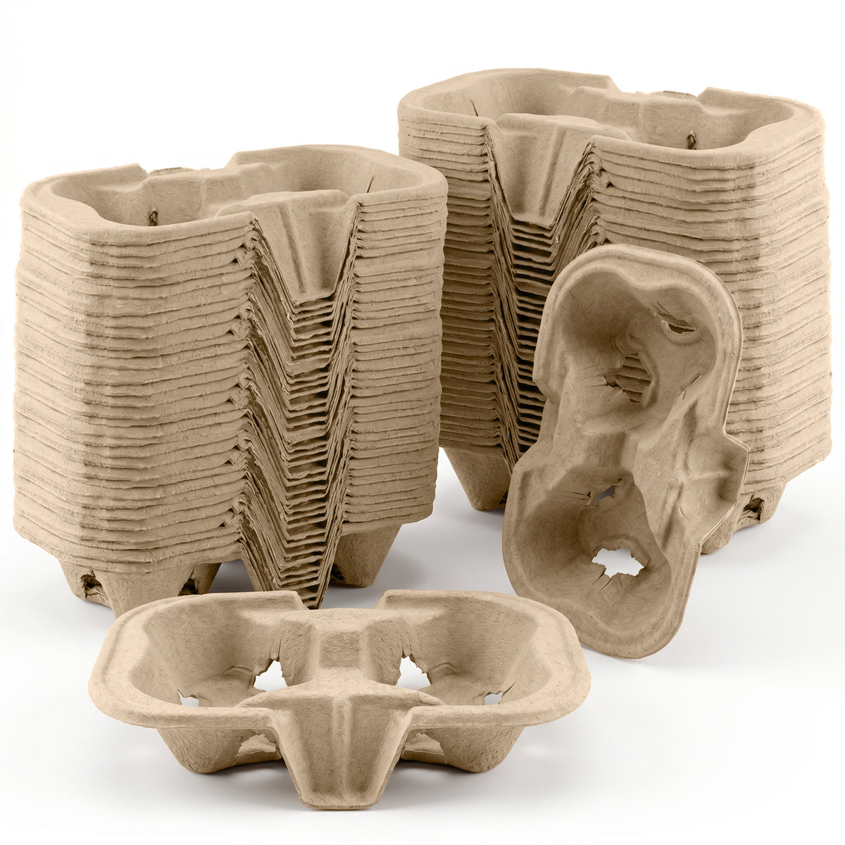 A stack of biodegradable coffee cup carriers made of brown paper pulp.