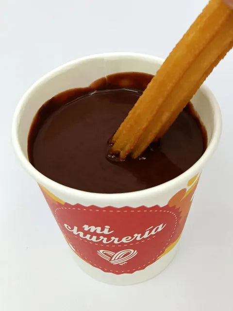 Mi Churreria Gold Range hot chocolate powder in a 12kg box, formulated for use in chocolate dispensers, rich in cocoa butter and infused with vanillin