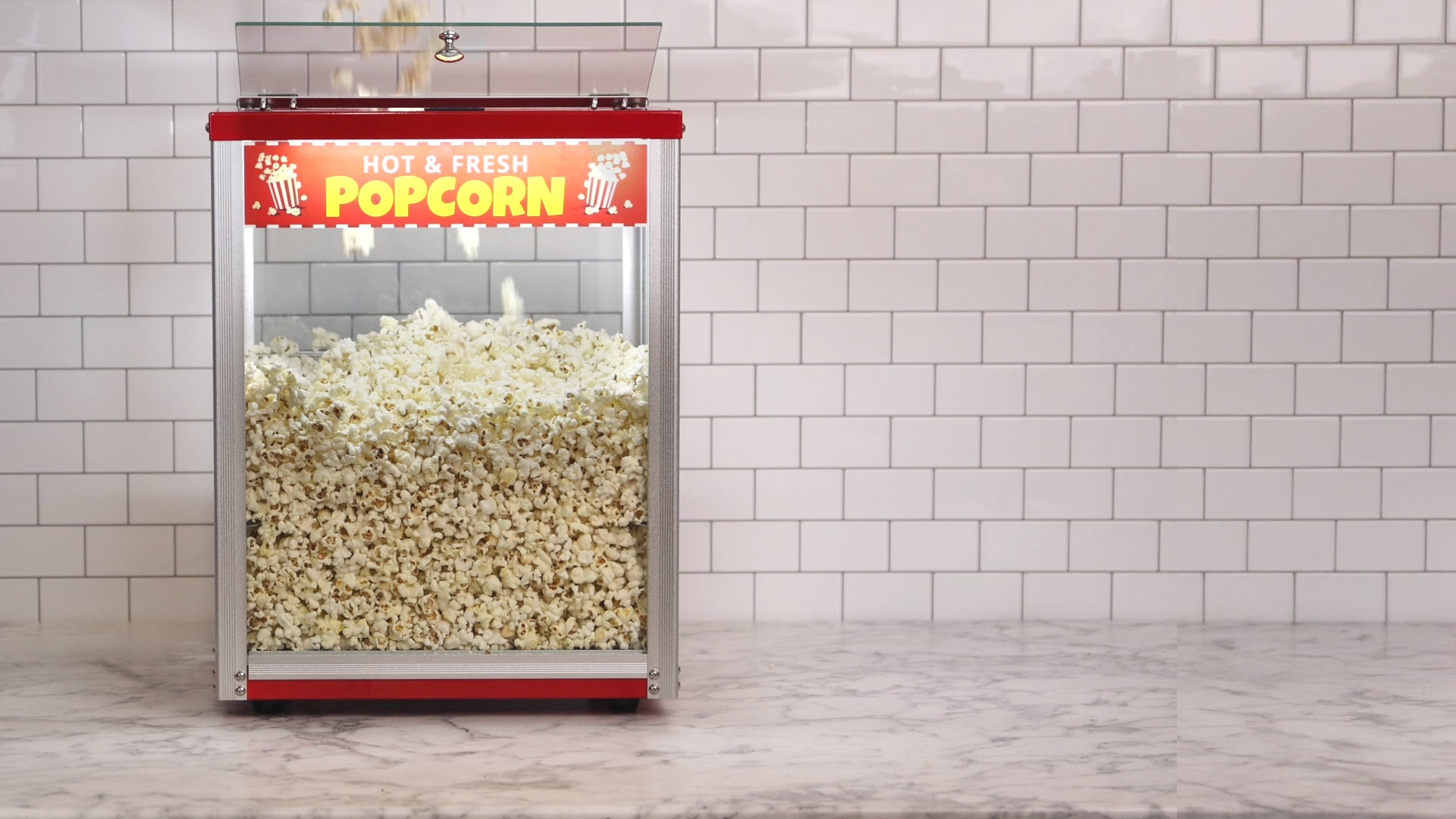 HAXRO Popcorn Warmer model HX8447 with a sleek, modern design and glass display, keeping popcorn warm and crisp inside. Ideal for home, concession stands, or small commercial use