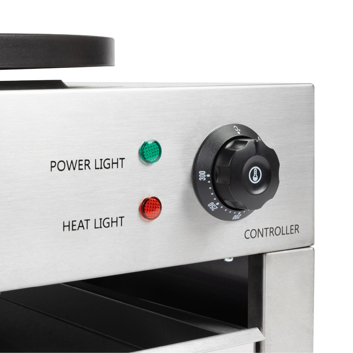 Close-up of the crepe maker’s control panel showing the temperature dial, green power light, and red heat indicator light.