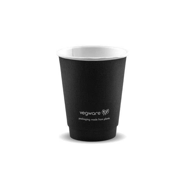 A black disposable cup with a white interior, featuring the text "vegware packaging made from plants" on the front.