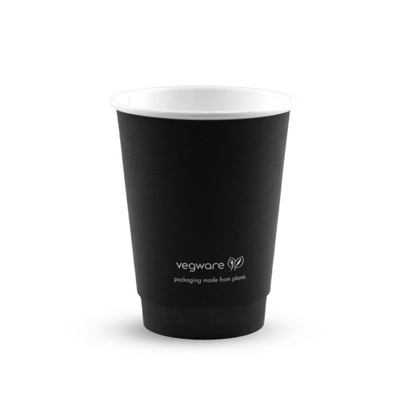 A black disposable cup with a white interior, featuring the text "vegware packaging made from plants" on the side.