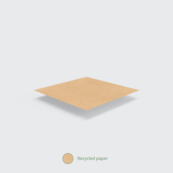 A flat piece of recycled paper on a light background.