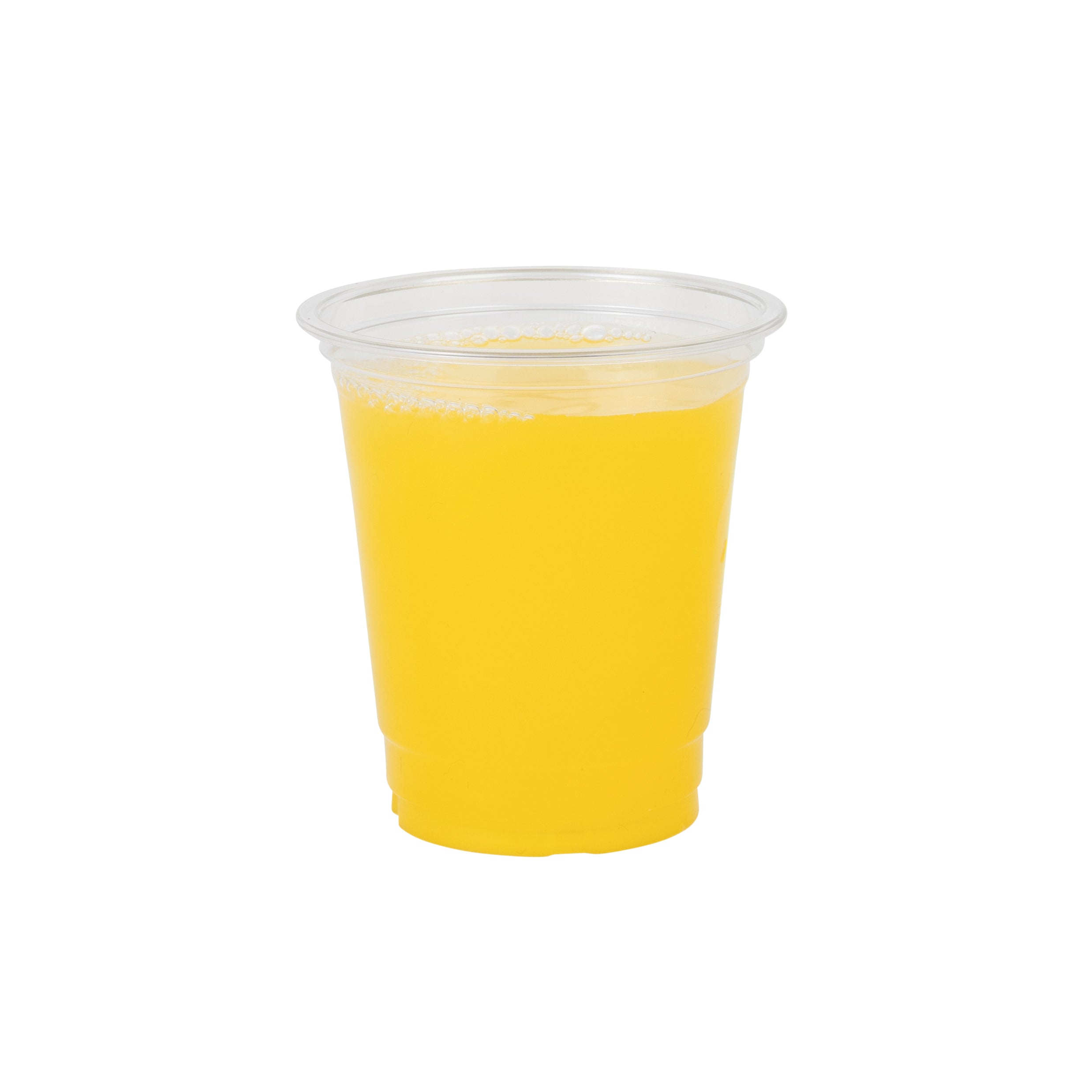 A clear plastic cup filled with bright yellow juice, centered on a white background; its simple presentation feels clean and refreshing.